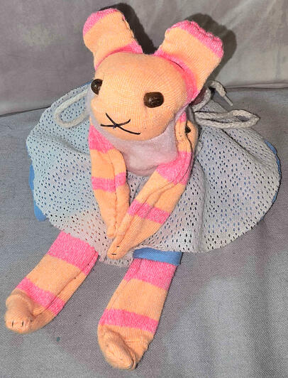 Orange and pink with wooden bead eyes.